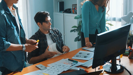 Top view of project manager looking at screen while designer writing idea. Close up of smart business team explain idea of logo design while designer choose theme while looking at palette. Symposium.の写真素材