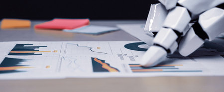 A business analyst collaborates with AI technology, identifying market trends to enhance research accuracy and marketing plans in a contemporary office space.の写真素材