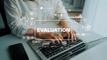Business Professional Conducting Digital Evaluation with Data Analytics Graphics on Laptop Keyboard. Asymptotic smart data analytic.の写真素材