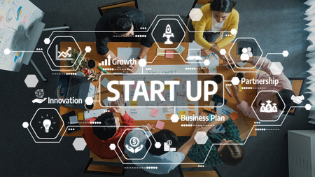 Collaborative Startup Meeting with Diverse Team Discussing Business Growth Strategies and Innovative Ideas for Success in Modern Workspace.の写真素材