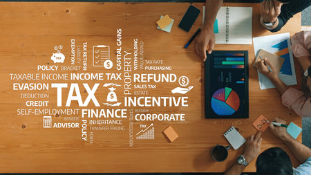 In this engaging image, professionals collaborate on vital tax concepts, focusing on finance, incentives, corporate strategies, and the importance of proper tax planning in a modern environment.の写真素材