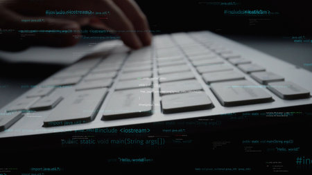 A close-up view of hands typing on a sleek keyboard, with visual coding symbols overlaying the scene, symbolizing technology, programming, and digital communication.の写真素材