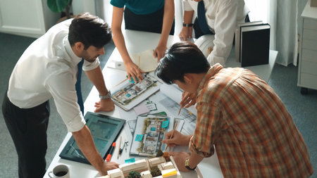 Smart architect or civil engineer writing building structure idea on note and stick on blueprint....