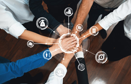Group of diverse office worker join hand together in office room symbolize business synergy and...