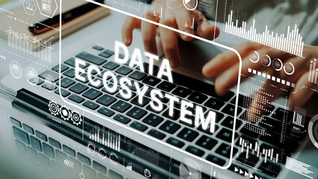Focused Hands Typing on Laptop Keyboard Surrounded by Data Ecosystem Graphics and Analytics Visuals in Modern Workspace. Asymptotic smart data analytic.の写真素材