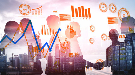 Business professionals engage in a handshake, symbolizing partnership, with data visualizations...