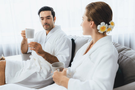 Beauty or body treatment spa salon vacation lifestyle concept with couple wearing bathrobe relaxing...