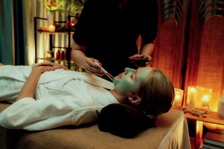 Serene ambiance of spa salon, woman customer indulges in rejuvenating with luxurious face cream...