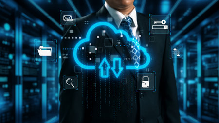 A businessman in a suit stands confidently in front of a cloud computing interface with digital...