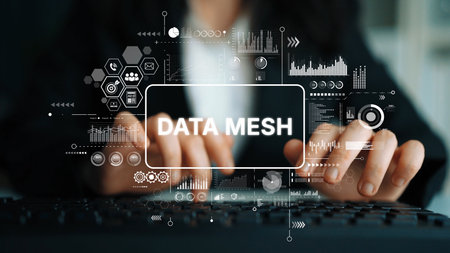 Hands typing on keyboard with futuristic data mesh graphics overlay indicating technology and digital innovation concepts. Asymptotic smart data analytic.の写真素材