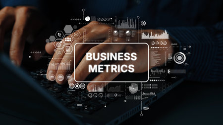 Hands Typing on Laptop with Overlaid Graphics of Business Metrics and Data Analysis Concepts. Asymptotic smart data analytic.の写真素材