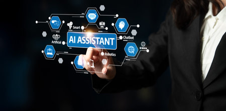 A business professional engages with a virtual AI assistant interface showcasing various digital technology icons, illustrating innovation and modern workspace. Tesselの写真素材