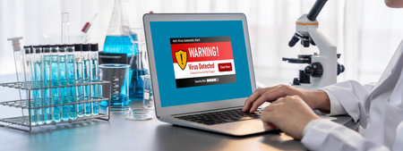 Virus warning alert on computer screen detected brisk cyber threat , hacker, computer virus and malwareの写真素材