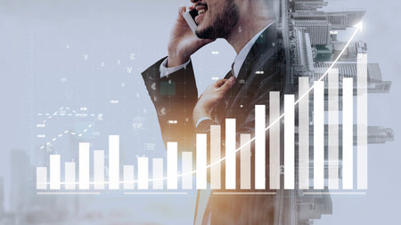 Professional businessman speaks on phone while standing with financial growth graph overlay. A perfect image representing success, data analysis, and economic advancement. Copulaの写真素材