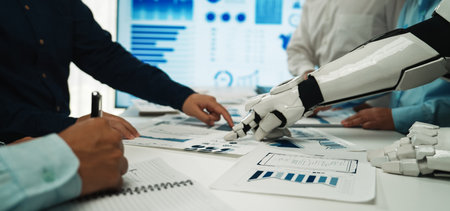 A dynamic meeting showcasing the collaboration between humans and robotic technology. Charts and...