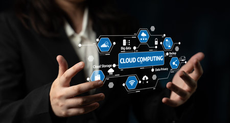 A business professional showcases cloud computing concepts through digital icons, emphasizing data...
