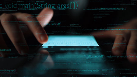 Close-up view of hands interacting with a smartphone while programming code overlays fill the dark background, symbolizing modern technology and digital innovation. Xenicの写真素材