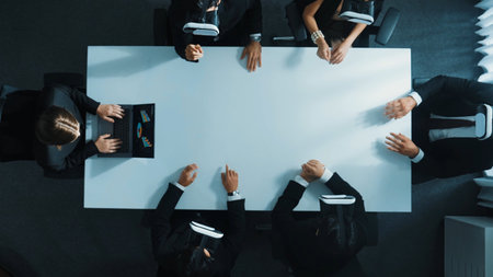 Top down aerial view of professional business team wear vr headset to enter virtual world while sitting and using hand gestures to manipulate the data from the manager laptop. Technology. Directorate.の写真素材