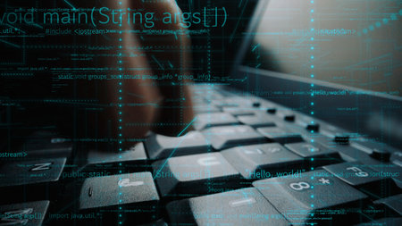 A close-up view of a keyboard with a hand typing, overlaid with coding symbols and digital elements,...