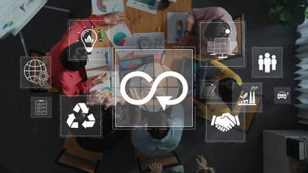 A vibrant team engages in a collaborative meeting focused on sustainability, featuring charts, recycling symbols, and global icons, showcasing innovative ideas and teamwork. Rasterの写真素材