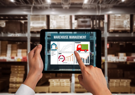Warehouse management innovative software in computer for real time monitoring of goods package delivery . Computer screen showing smart inventory dashboard for storage and supply chain distribution .の写真素材
