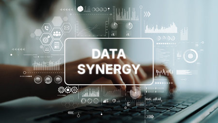 Innovative Data Synergy Concept with Hands on Keyboard and Digital Graphs Illustrating Modern Technology and Analytics. Asymptotic smart data analytic.の写真素材