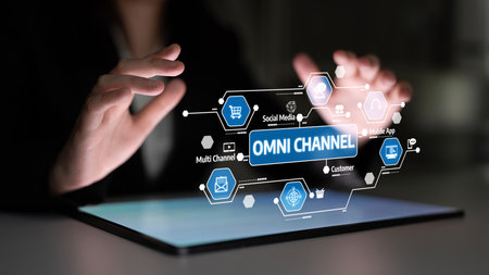 A close-up view of hands interacting with a digital interface representing omni channel concepts like social media and customer engagement in a modern business environment. Tesselの写真素材
