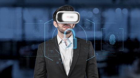 A businessman wearing a virtual reality headset stands in a modern workplace, surrounded by digital...