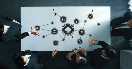 Collaborative Business Meeting with Digital Interface Overhead View Showcasing Technology and Data...