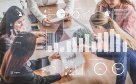 A dynamic business team collaborates in a modern workspace, utilizing digital tools for data...