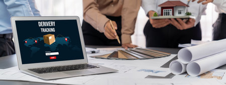 Group of interior architect designer discussing together on blueprint and laptop screen display for...
