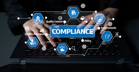 A close-up view of hands typing on a laptop, surrounded by icons representing compliance, quality...