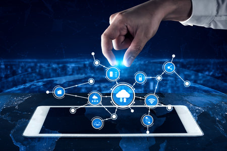 A creative representation of digital connectivity, featuring a hand engaging with a cloud network...