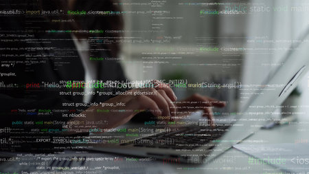 A close-up of a person focused on typing code on a laptop, surrounded by dynamic lines of...