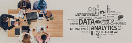 A diverse team collaborates at a modern workspace, focusing on data analytics, utilizing laptops and...
