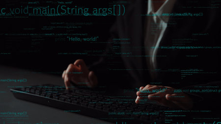A close-up view of hands typing on a keyboard with coding text overlay, illustrating programming...