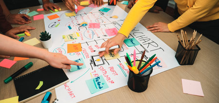 A vibrant scene showcasing a collaborative brainstorming session where team members engage over a...