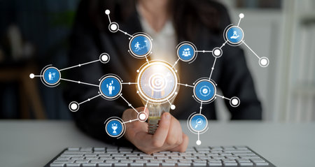 This image captures a conceptual visualization of data networking in a modern office. Digital...