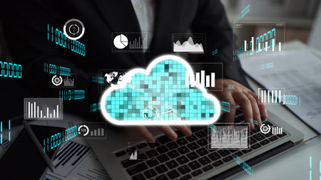 A blend of technology and data analysis showcases a user typing on a laptop with cloud graphics and...