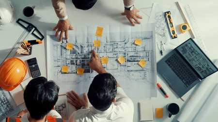 Top down aerial view of smart architect engineer team walking at meeting table while prepare for...