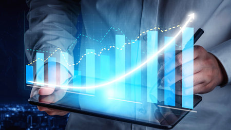 A business professional interacts with a tablet featuring a digital growth chart, symbolizing data...