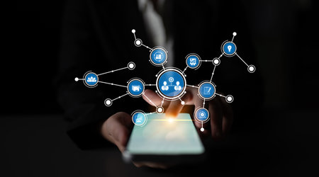 A businessperson is seen interacting with a mobile device, highlighting digital network connections....