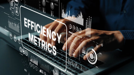 Business professional analyzing efficiency metrics with digital graphs and statistics on a laptop in...