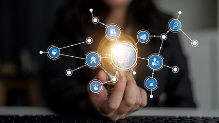 A captivating visual representation of innovative ideas with a lightbulb and networked digital icons, symbolizing creativity, technology, and business growth possibilities. Tesselの写真素材