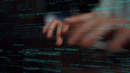 A person types intently on a laptop keyboard, immersed in a digital environment filled with code and...