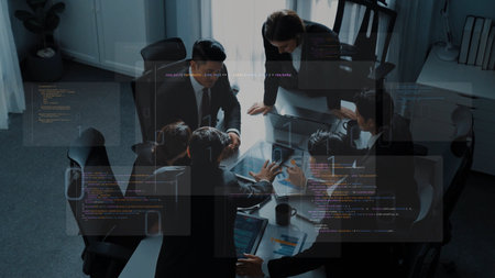A group of professionals collaborates in a modern office, utilizing technology for effective...