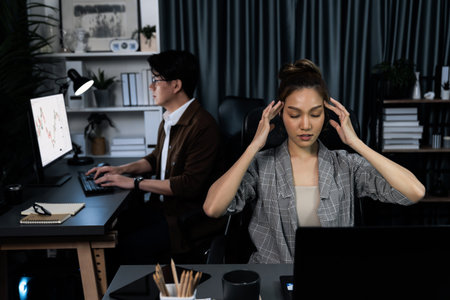 Businesswoman working on desk with stretching arm up and down manner with body health ache of strain...