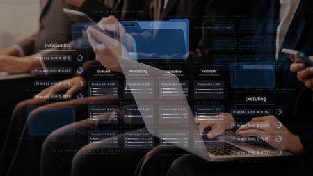 Modern business professionals engage with digital devices in a collaborative environment. The image...
