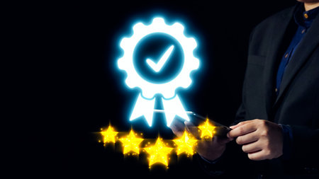 Businessman Holding Smartphone with Digital Badge and Five Star Rating, Symbolizing Quality and...