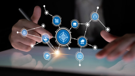 A business professional engages with a tablet, showcasing interconnected social media icons that...